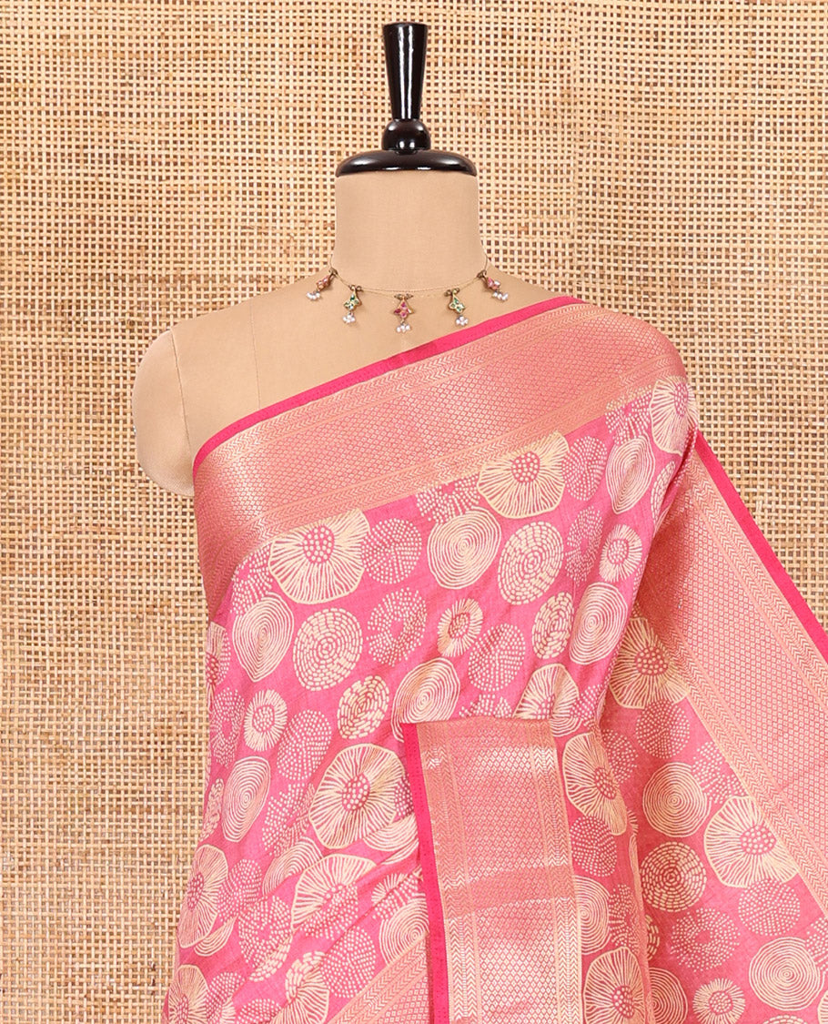 Pink lotus-leaf style printed semi-tussar saree, traditional zari border, zari striped pallu, and a matching blouse