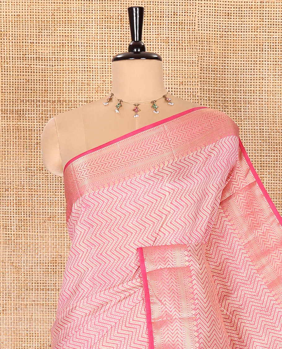 Pink Semi-Tussar Saree Accentuated with Zig-Zag Strips Prints, Featuring a Self-border with Traditional Motifs, a Zari-Striped Pallu, Paired with a Matching Blouse
