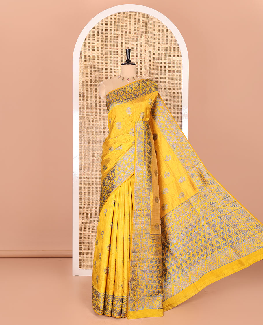 Mustard Semi-Tussar Saree Subtly Woven With Floral Zari Buttas, Featuring a Geometric-Patterned Zari Border, Adorned With a Butta-Enclosed Checked Pallu, and a Matching Blouse
