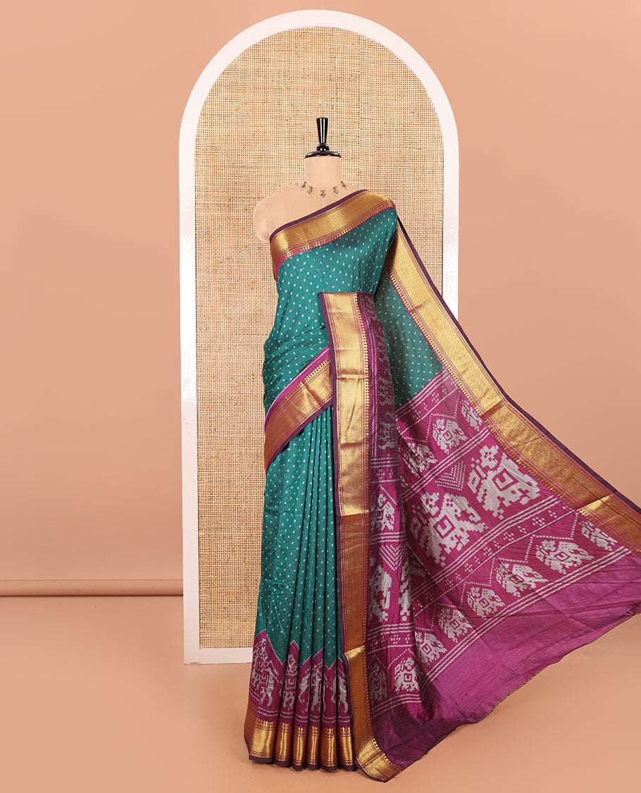 Peacock Green Patola Saree Subtly Sparked with Ikkat Style Polka Dots and Elephant Buttas, Complemented by a Contrast Traditional Zari Design Border, Featuring Pallu Steeped with Elephant Motifs, and Paired with a Contrast Blouse
