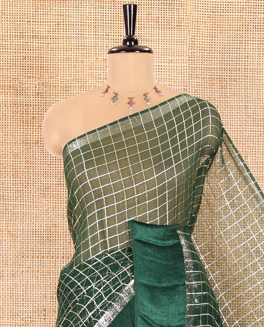 Green Viscose Georgette Saree Gleamed with Golden Zari Checks All Over Its Body, Adorned with a Satin Plain Border, a Self Pallu Featuring the Same Checks, and Paired with a Running Blouse