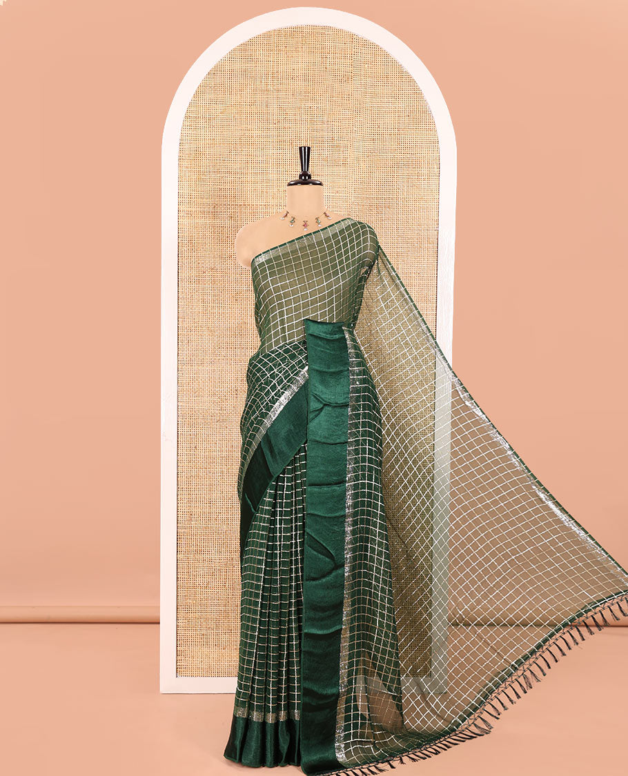 Green Viscose Georgette Saree Gleamed with Golden Zari Checks All Over Its Body, Adorned with a Satin Plain Border, a Self Pallu Featuring the Same Checks, and Paired with a Running Blouse