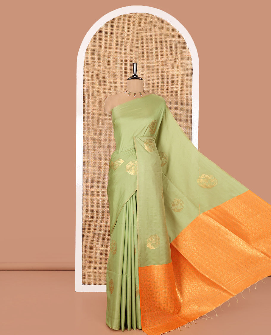 Borderless Green Semi-Soft Silk Saree Adorned with Bird-Floral Buttas All Over Its Body, Complemented by a Contrast Intricately Designed Pallu, and Paired with a Contrast Plain Blouse