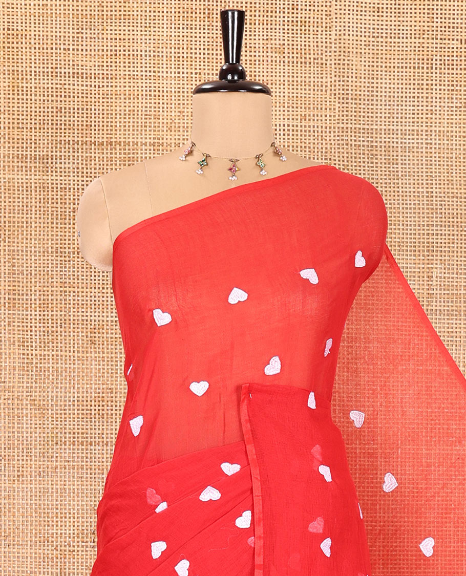 Borderless Red Khadi Mul Cotton Saree, Artfully Designed with Heart Motifs Embroidery Across Its Body, Pallu mirrors the Same Design, and Paired with a Matching Blouse