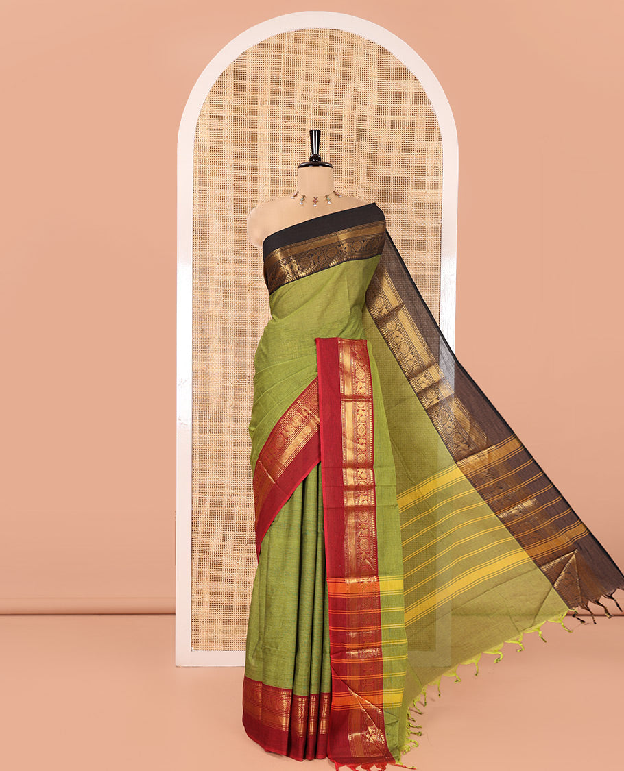 Green Plain Chettinad Cotton Saree, Complemented By Contrast Kal Eragina Traditional Zari Designs Woven Border, Subtly Striped Pallu, and Paired with a Matching Blouse