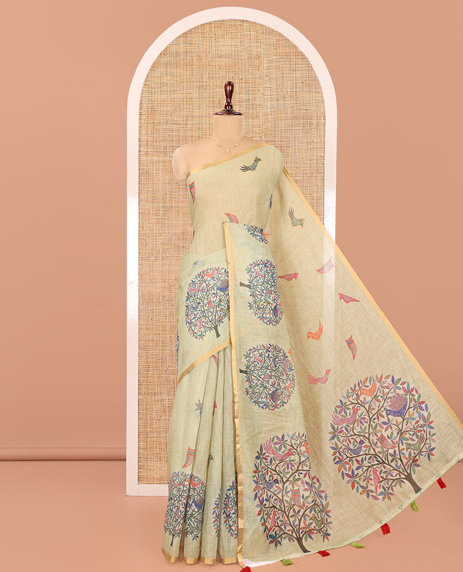 Pista Green Linen Cotton Saree, Steeped in the Richness of Nature-Themed Motifs Like Bird, Owl, and Tree, a Subtle Piping Border, Pallu of Tree Motifs, and Paired with a Matching Blouse