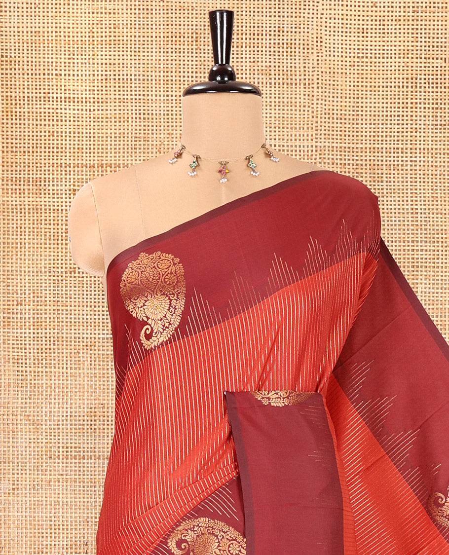 Reddish Brown Kanchi Soft Silk Saree, Majestically Detailed with Vaira Oosi, and Zari Buttas All Over Its Body, Complemented by Contrast Border of Paisleys, an Intricately Designed Pallu, and Paired with a Contrast Blouse