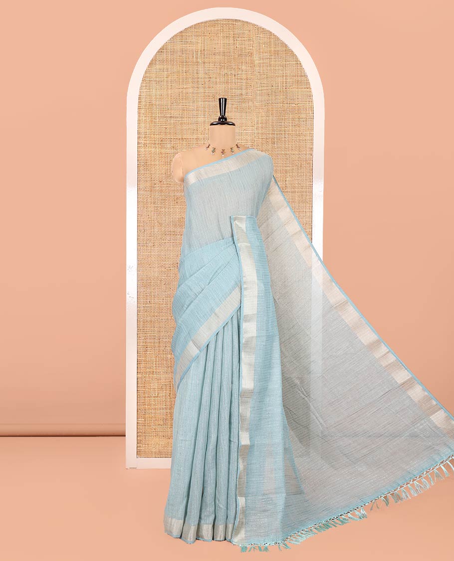 Rama Green Linen Zari Cotton Saree, Gleamed Up with Zari Stripes All Over Its Body, a Subtle Zari Border, a Self-Pallu, and Comes Without a Blouse