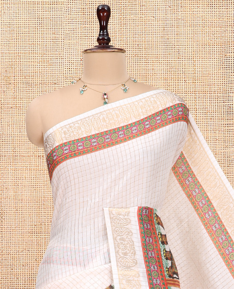 Cream Semi-Tussar Saree Features Checks and Elephant Print, a Paisley Zari Border, and a Contrast Blouse