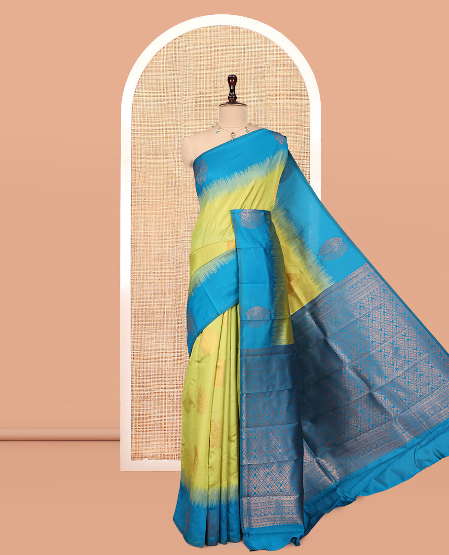 Parrot Green Kanchi Silk Saree, Adorned with Zari Buttas, a Contrast Zari Butta Border, Grand Pallu, and a Contrast Blouse