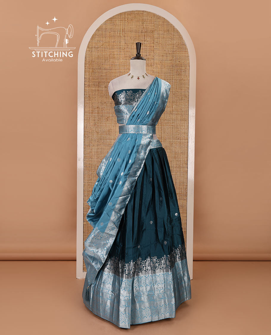 Bottle green-blue taffeta silk half-saree, zari buttas & contrast floral-geometric zari border skirt, zari woven blouse & contrast zari woven dhavani