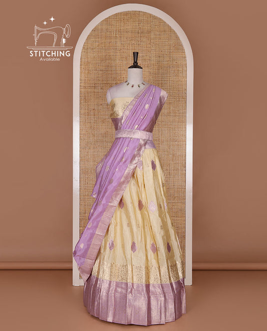 Cream taffeta silk half saree, meena buttas skirt, contrast lavender traditional zari border, matching blouse, and zari woven dhavani