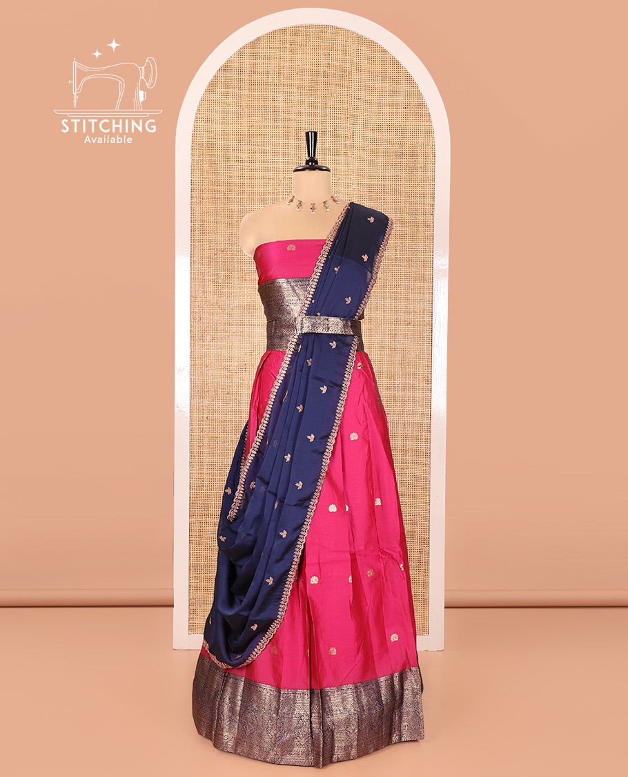 Pink and Navy Blue Semi-Banarasi Half-Saree, Adorned with Zari Buttas on Its Skirt, Complemented by a Contrast Traditional Zari Designs Woven Border, Paired with a Matching Blouse, and a Satin Georgette Embroidered Scallop Dhavani