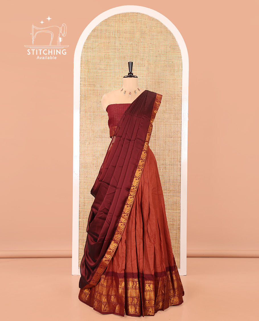 Rust and Maroon Plain Sungudi Cotton Half-saree, Complemented by Captivating Contrast Traditional Zari Border of Temple, Peacock, and Elephant Designs, Paired with a Contrast Zari Checked Blouse, and Comes with a Zari-Bordered Vichitra Silk Dhavani