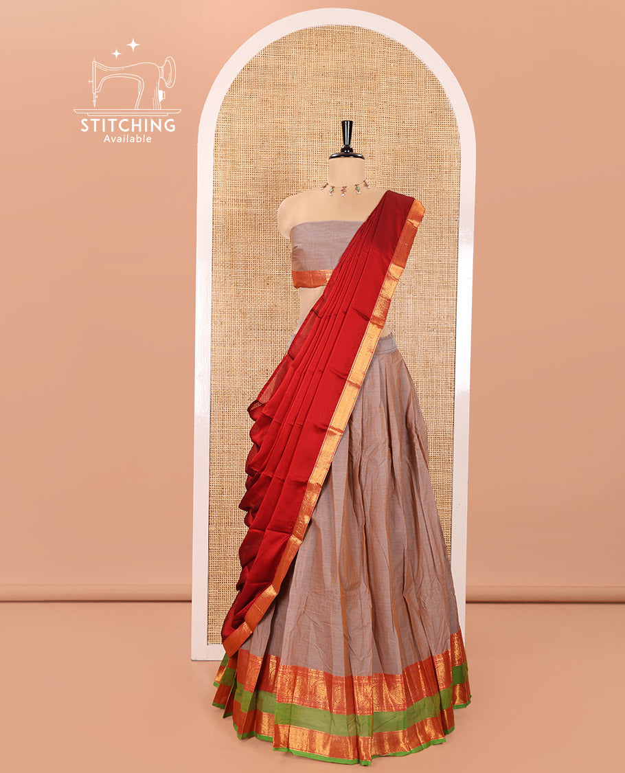 Grey Chettinad Cotton Half-Saree Featuring Plain Skirt, Complemented by Contrast Rettai Pettu Border of Round Peacock and Peacock Eye Designs, Paired with a Matching Blouse, and a Satin Georgette Zari Bordered Dhavani