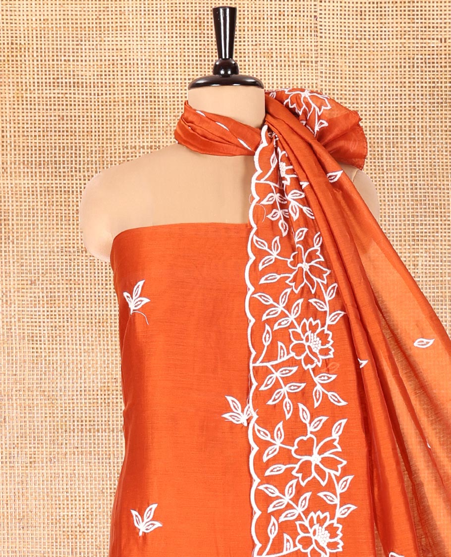 Rust Mul Chanderi Material Chudidar Set, Delicately Woven with Floral Embroidery on Its Top, a Plain Santoon Bottom, and Paired with a Floral Embroidered Scallop Dupatta