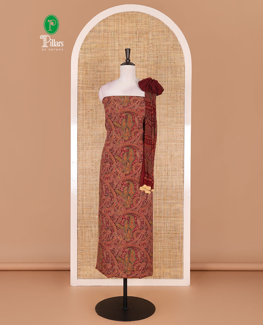 Reddish maroon Italian crepe material chudidar set, paisley printed top, plain bottom, and floral-paisley printed georgrette dupatta