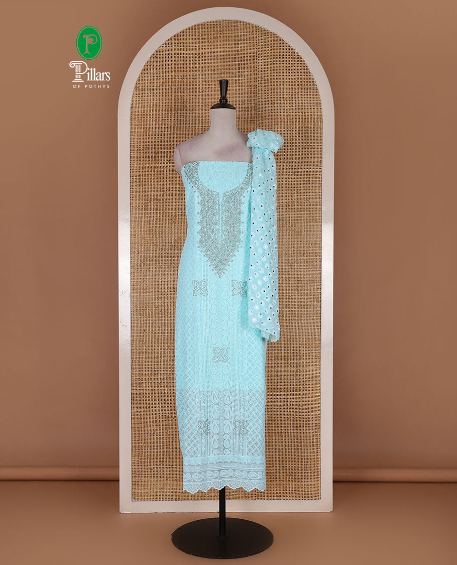 Blue material churidar set, stone work with Schiffli style embroidered georgette top, American Crape bottom, and polka dotted printed mirror work dupatta