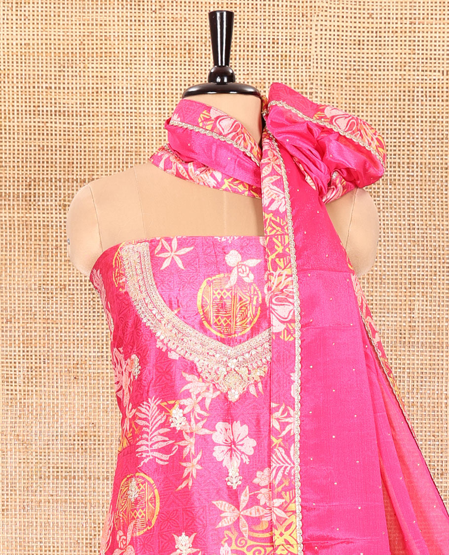 Rani Pink Material Chudidar Set Adorned with Floral-Geometric Printed with Neck Embroidered Chinon Top, Subtly Made Plain Santoon Bottom, and a Chinon Dupatta Featuring Printed Border, and Glitter Dots