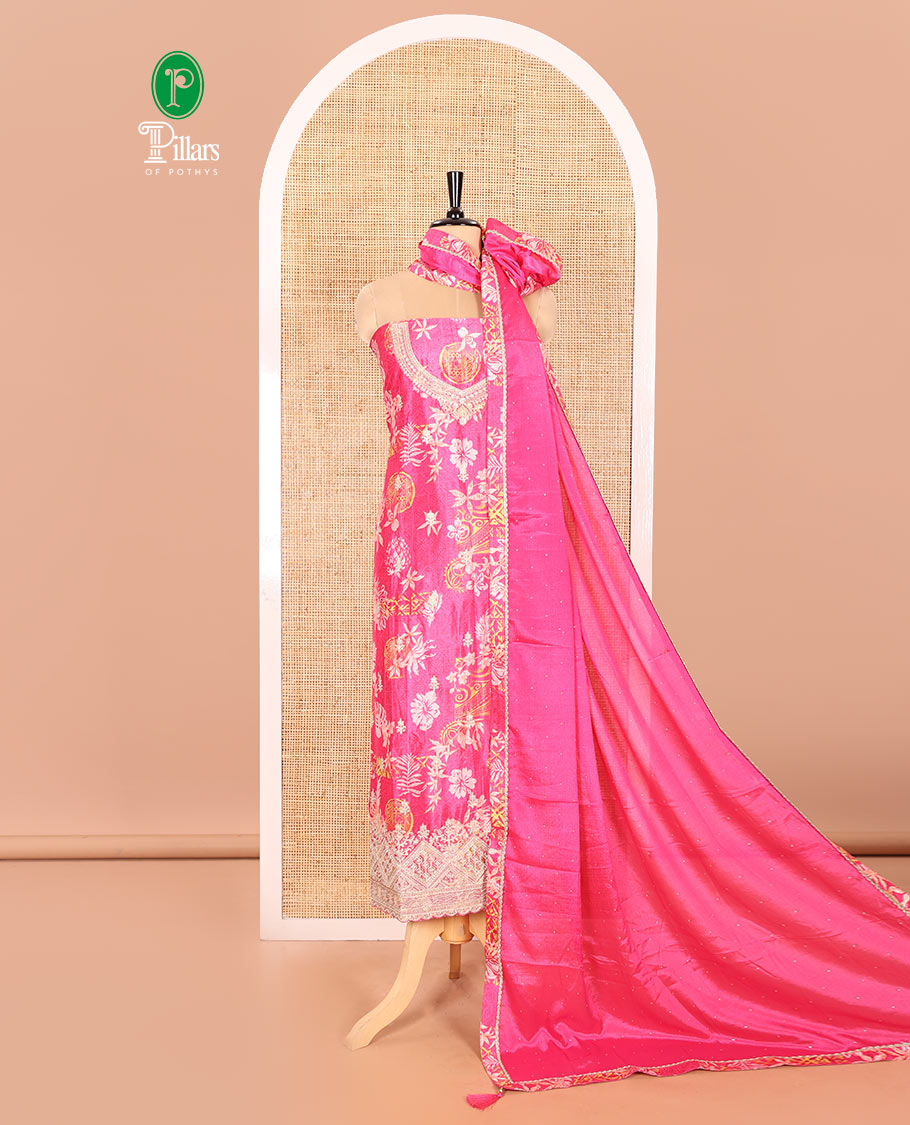 Rani Pink Material Chudidar Set Adorned with Floral-Geometric Printed with Neck Embroidered Chinon Top, Subtly Made Plain Santoon Bottom, and a Chinon Dupatta Featuring Printed Border, and Glitter Dots