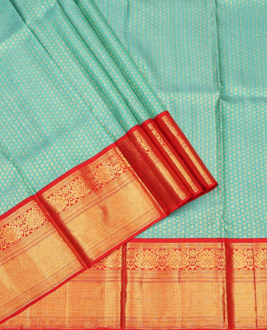 Blue Pure Silk Half-Saree, Gleamed Up with Zari Buttas on Its Skirt, Complemented by a Contrast Border Featuring Kodi Visiry, Neli, Muthu, and Jaal Designs, Comes with a Contrast Blouse and a Dhavani of Jaal Designs