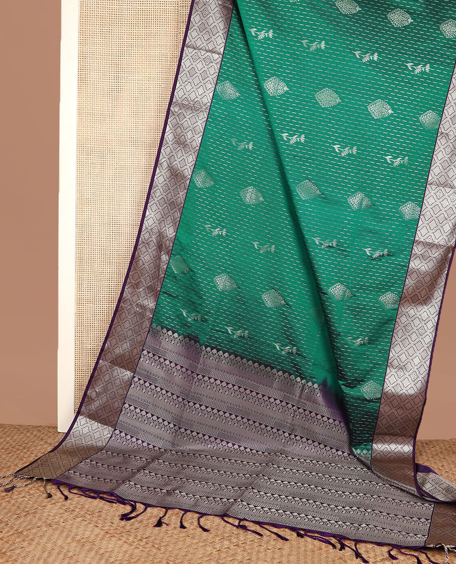 Green zari designs soft silk saree, contrast jaal zari border, and pallu of traditional zari designs