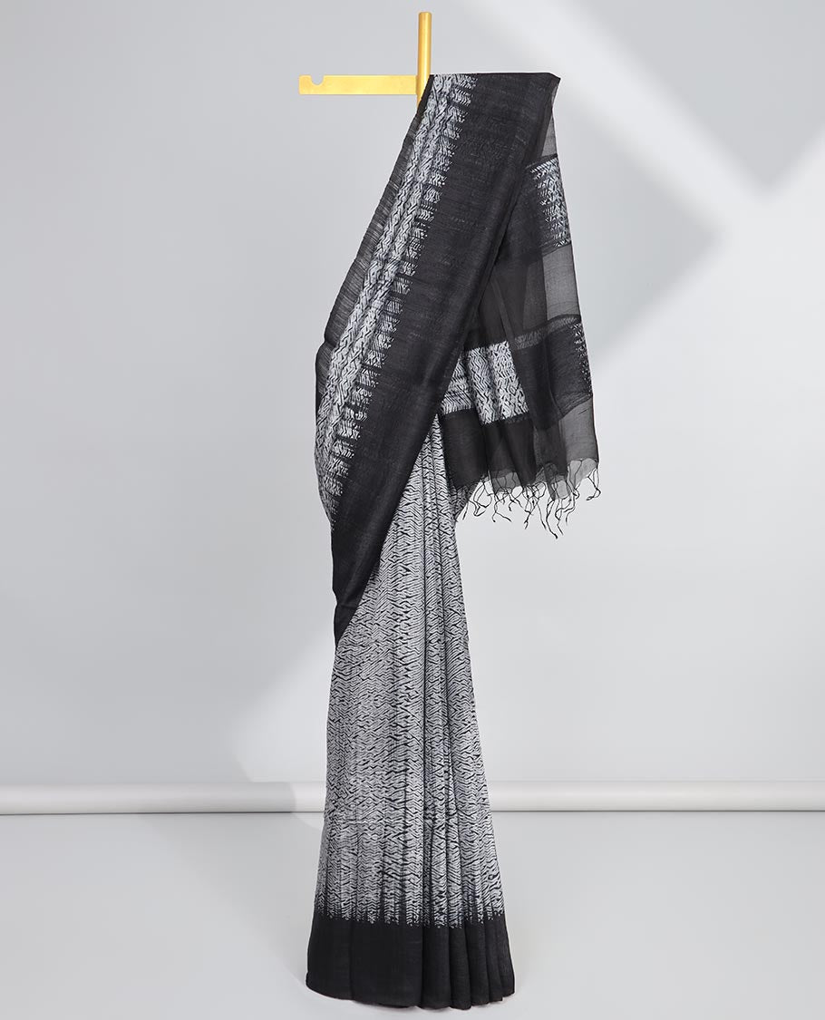 Grey abstract design matka silk saree with contrast plain border & black abstract design pallu