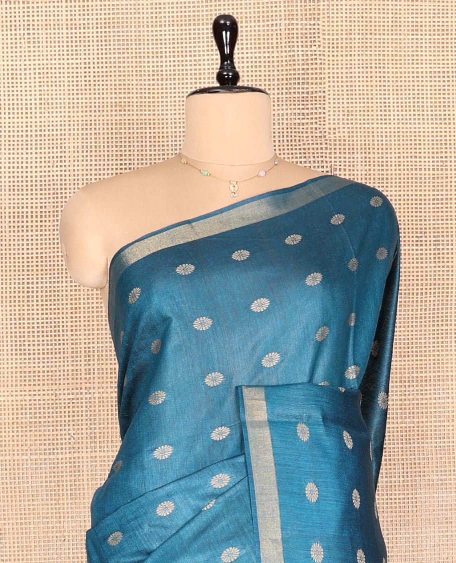 Blue Tussar Silk Saree, Steeped with Floral Buttas, a Subtle Border, Pallu Features Stripes and Buttas, and a Matching Blouse