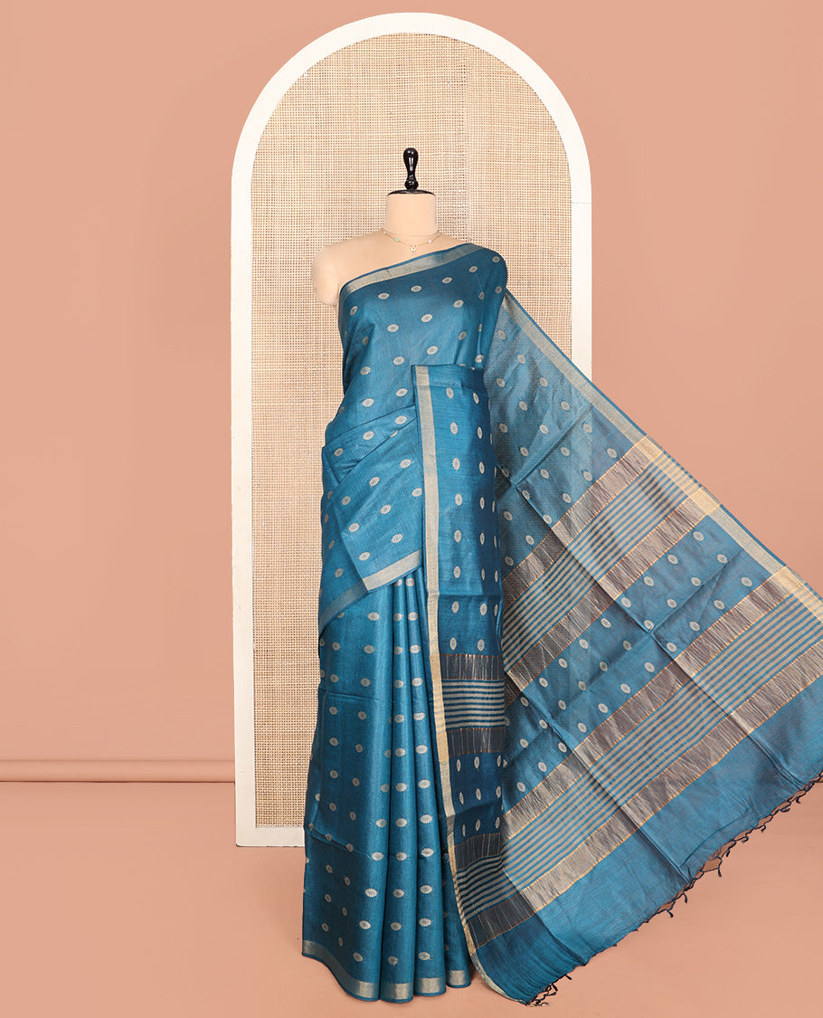 Blue Tussar Silk Saree, Steeped with Floral Buttas, a Subtle Border, Pallu Features Stripes and Buttas, and a Matching Blouse