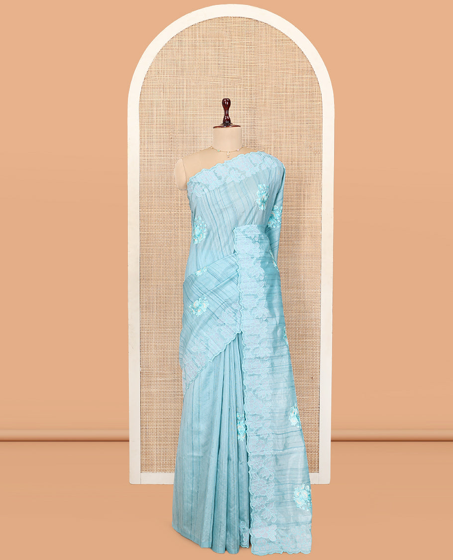 Blue Tussar Silk Saree Features Stripes and Floral Embroidery, a Scallop-Embroidered Border, and a Matching Blouse