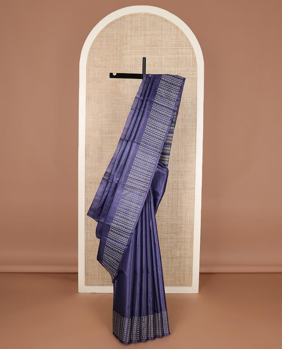 Blue plain tussar silk saree, self border and pallu features geometric patterns, and temple motifs