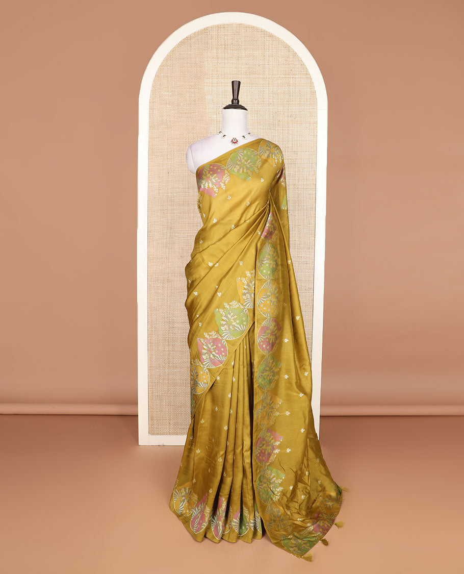 Borderless mustard Matka silk saree features floral and scallop bird motifs in meenakari style