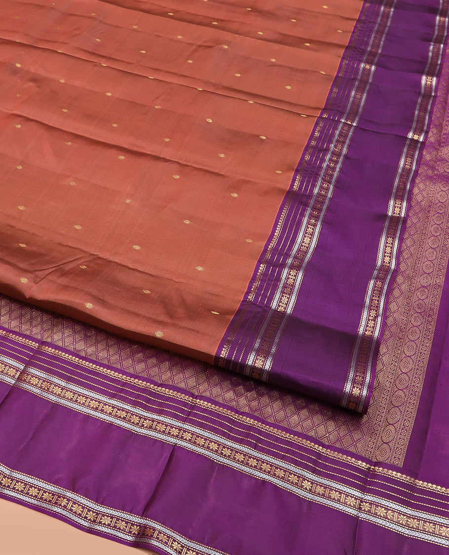 Rust Vasundhara Lite Silk Mix Saree Adorned with Rudraksham Buttas, Complemented by Contrast Varisai Pettu Border of Thilakam Mokku, Muthu, Kathir, and Star Vanki Designs, Pallu of Jaal Designs, and Paired with a Contrast Blouse