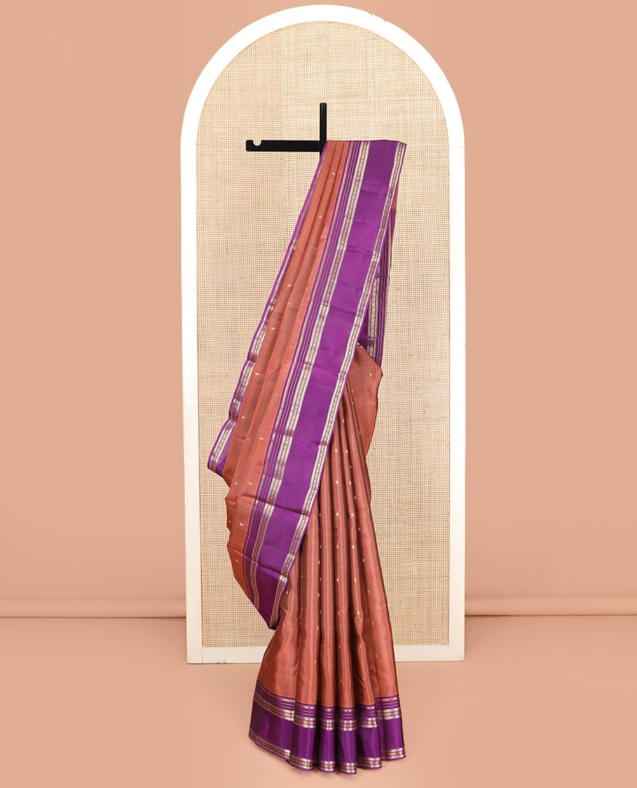 Rust Vasundhara Lite Silk Mix Saree Adorned with Rudraksham Buttas, Complemented by Contrast Varisai Pettu Border of Thilakam Mokku, Muthu, Kathir, and Star Vanki Designs, Pallu of Jaal Designs, and Paired with a Contrast Blouse
