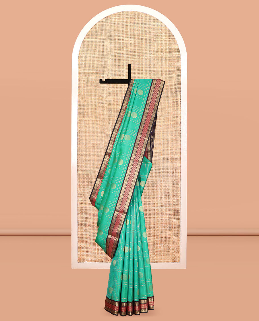 Green Vasundhara Lite Silk Mix Saree Features Butta Enclosed Checks, a Contrast Manga Design Border, Mayil-Chakram Pallu, and Contrast Blouse