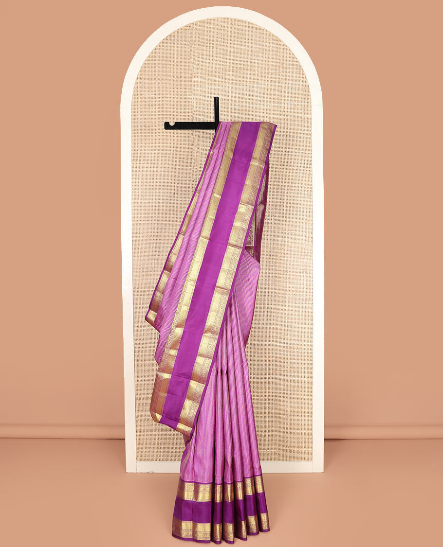 Pink Vasundhara Silk Saree Accentuated with Zari Stripes, Complemented by a Contrast Border of Salangai, Rudraksham, Star, Kodi Mayil, Yaanai, and Mayil Kann Designs, Pallu Decked Up with Traditional Designs, and Paired with a Contrast Blouse