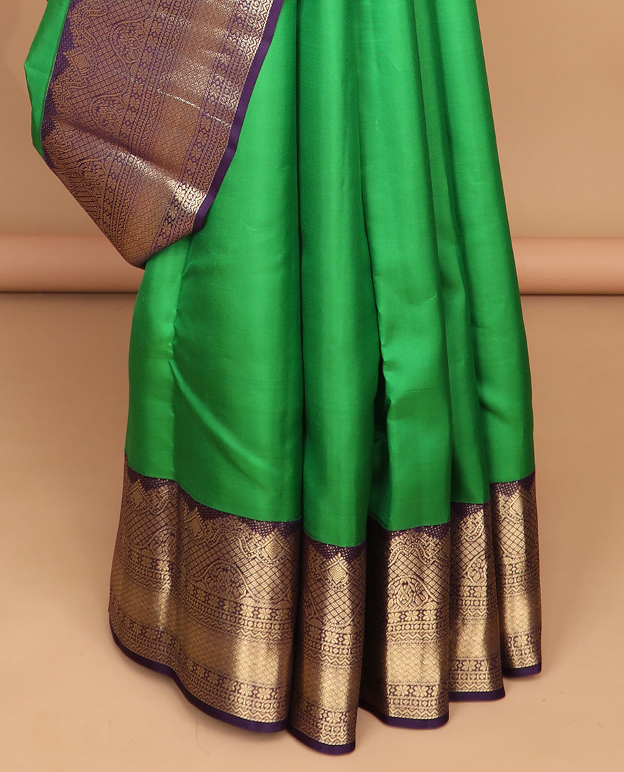 Green leaf buttas silk saree with contrast border of intracate zari design & floral design pallu