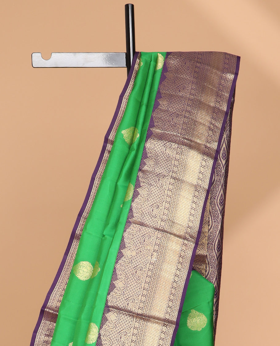 Green leaf buttas silk saree with contrast border of intracate zari design & floral design pallu