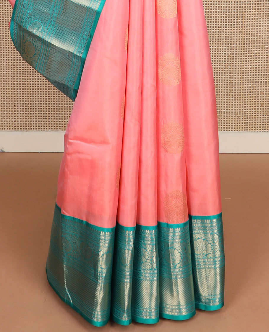 Pink zari buttas silk saree, contrast border of thilakam mokku, muthu, lavangam, kodi visiry, and kuyil kann designs, and chakram motifs steeped pallu