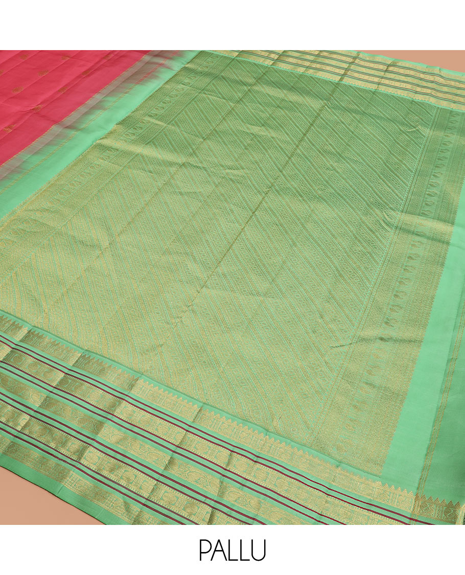 Red Vasundhara Silk Saree Subtly Woven with Zari Buttas, Complemented by a Contrast Varisai Pettu Border of Rekku, Mayil, Rudraksham, and Manga Designs, Pallu Adorned with Traditional Designs, and Paired with a Contrast Zari-Bordered Blouse