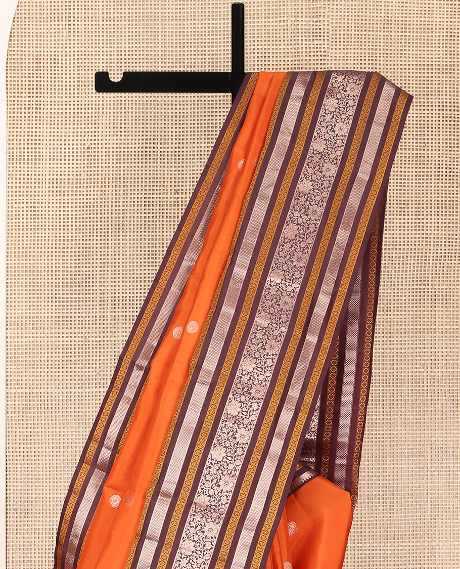 Orange Vasundhara Silk Saree, Adorned with Annam Chakram Buttas All Over Its Body, Complemented by Contrast Border of Thilakam, Neli, Laddu Kamalam, Mayil Kann, and Kodi Visiry Designs, Pallu of Butta Enclosed Checks, and Paired with a Contrast Blouse
