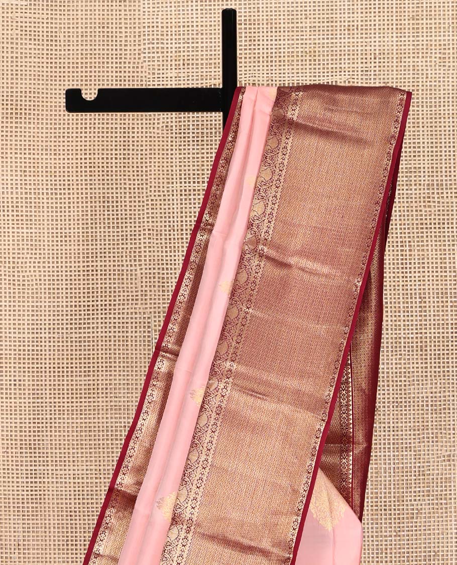 Pink Vasundhara Silk Saree, Adorned with Zari Buttas All Over Its Body, Complemented by a Contrast Border of Rekku, Iruthalai Pakshi, and Mayil Kann Designs, Grand Jaal-Patterned Pallu, and Paired with a Contrast Blouse
