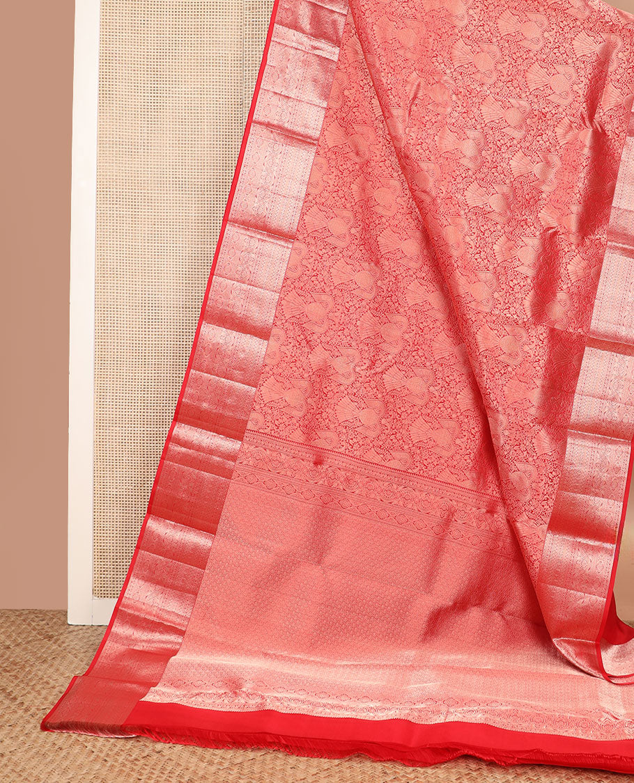 Orange iruthalai pakshi jacquard Kanchipuram wedding silk saree, zari traditional design border, and pallu of zari-rich jaal