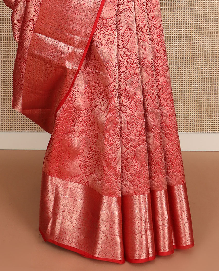 Orange iruthalai pakshi jacquard Kanchipuram wedding silk saree, zari traditional design border, and pallu of zari-rich jaal