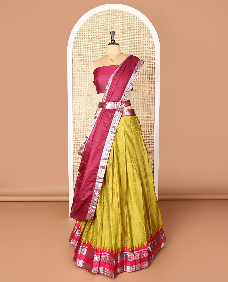 Green art-silk half-saree, plain with contrast temple traditional design bordered skirt, contrast blouse, and plain zari bordered dhavani