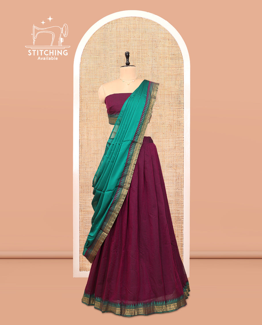 Purple Cotton Half-Saree Features Plain Skirt, a Contrast Temple Border, a Matching Blouse, and a Contrast Dhavani