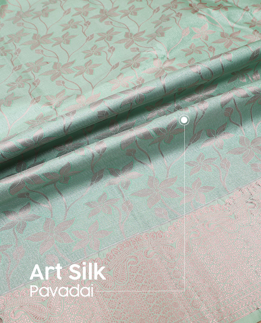 Green art silk pavadai set, floral jaal jacquard with traditional zari bordered skirt and a matching blouse