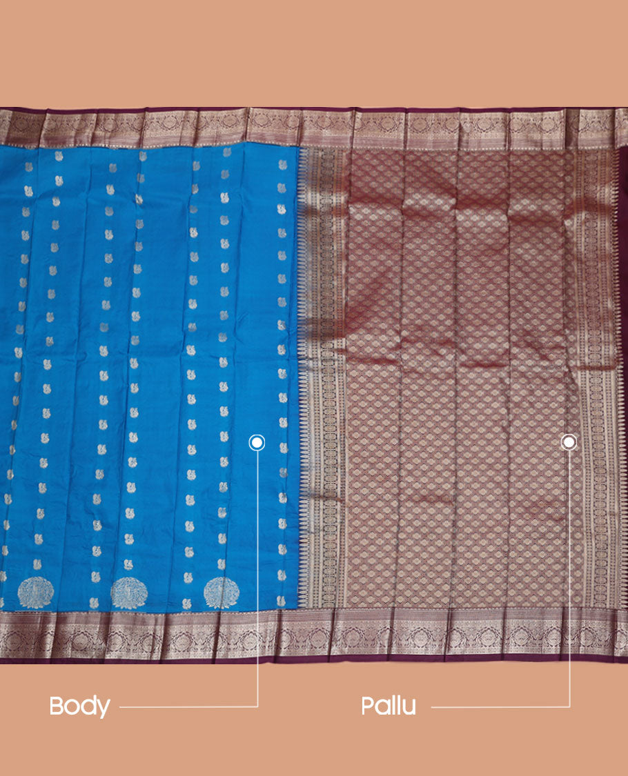 Blue Budget Silk Saree, Adorned with Peacock Buttas All Over Its Body, Complemented by a Contrast Border of Traditional Zari Designs, Grand Pallu of Jaal Designs, and Paired with a Contrast Blouse