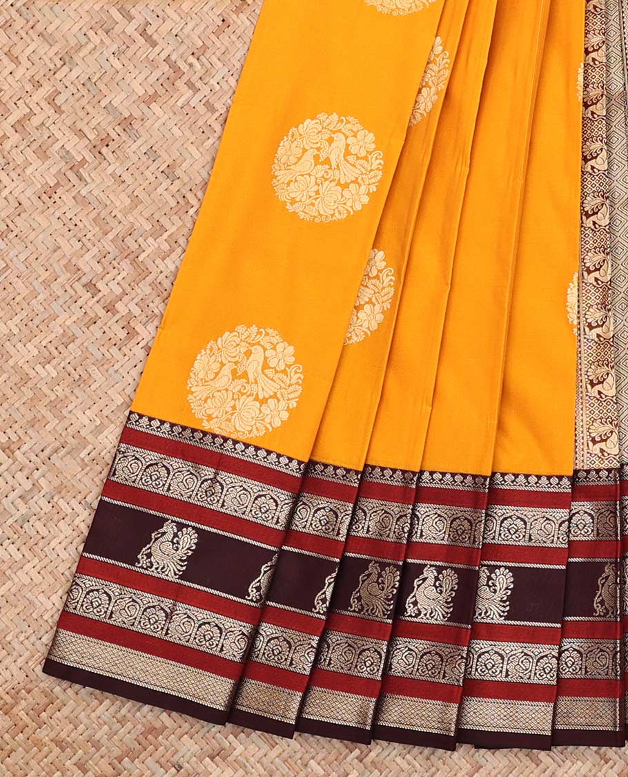 Yellow Budget Silk Saree, Adorned with Round Zari Buttas All Over Its Body, Complemented by Contrast Traditional Zari Designs Woven Border, Grand Jaal Pallu and Paired with a Contrast Blouse