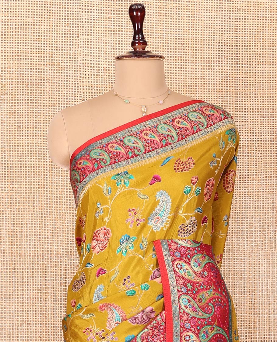 Mustard Dola Silk Saree, Elegantly Printed with Colorful Floral-Paisley Vine Design on Its Body, Complemented by Contrast Paisley Design Border, Pallu of Paisleys, and Paired with a Contrast Blouse